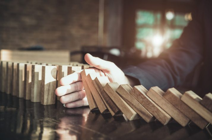 Dominoes Falling. You have to take risks to be successful.